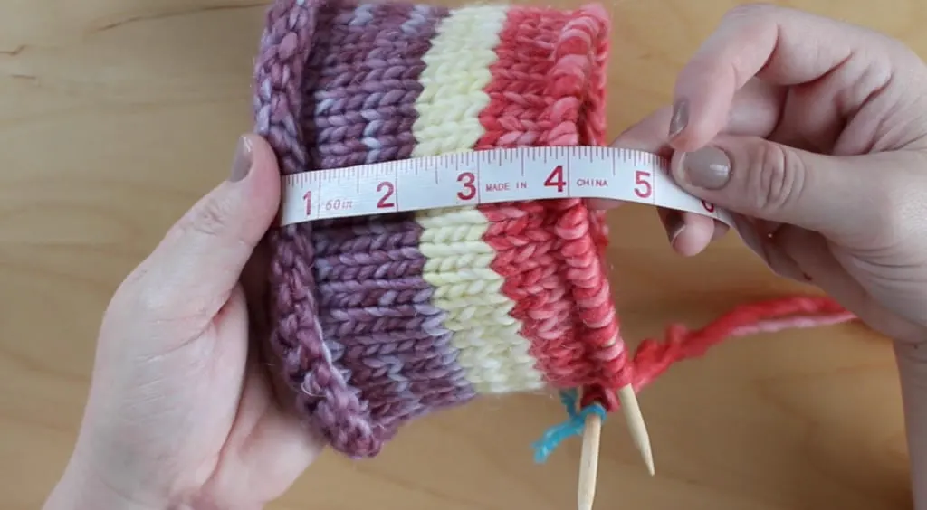Measuring tape of four inches with striped knitted nest