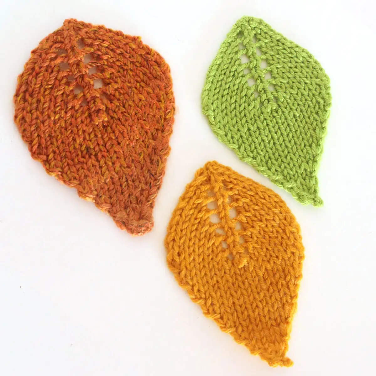 Three knitted leaf shapes.