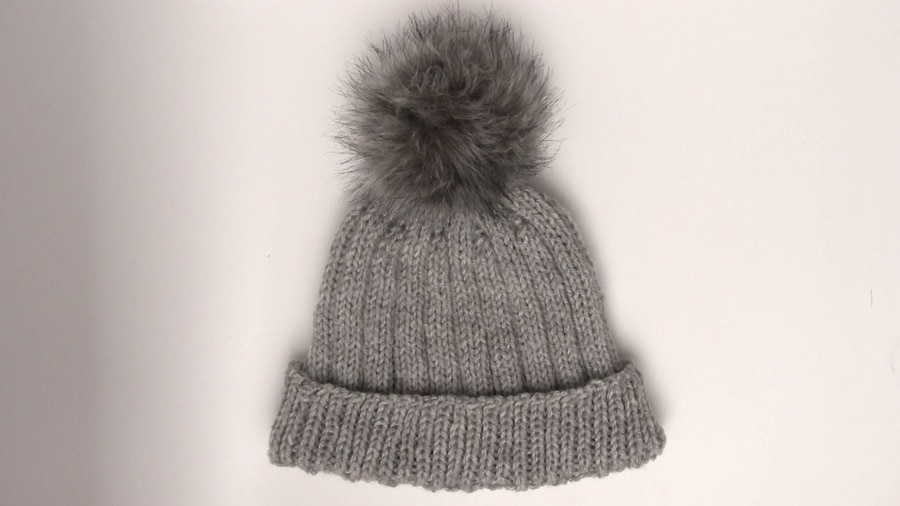 Knitted Ribbed Hat in gray colored yarn with faux fur pompom