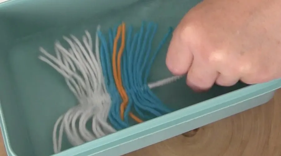 Soaking fiber feather into water bath.
