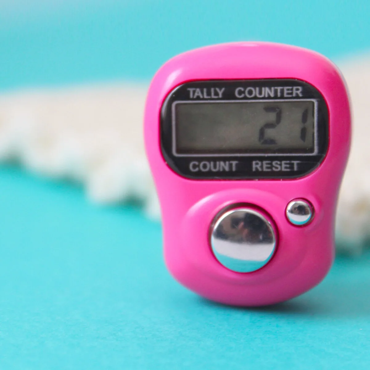 Digital Row Counter in hot pink on blue background for knitting stitches