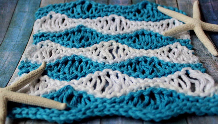 Learn How to Knit the Sea Foam Wave Drop Knit Stitch Pattern with Easy Free Pattern + Knitting Video Tutorial with Studio Knit.