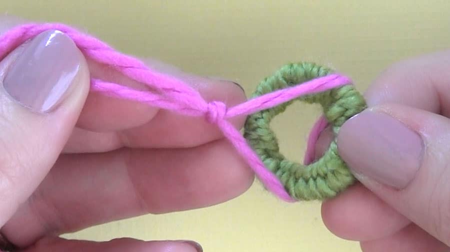 Adding a slip knotted yarn to a key ring.