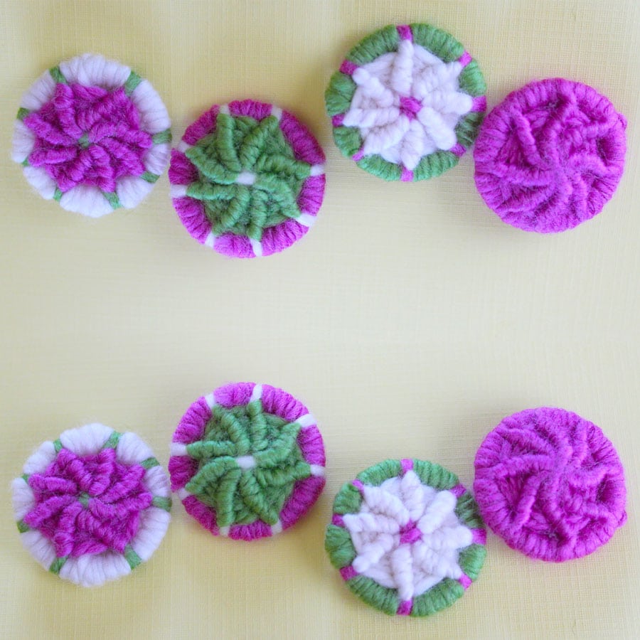 Dorset buttons decorated with yarn.