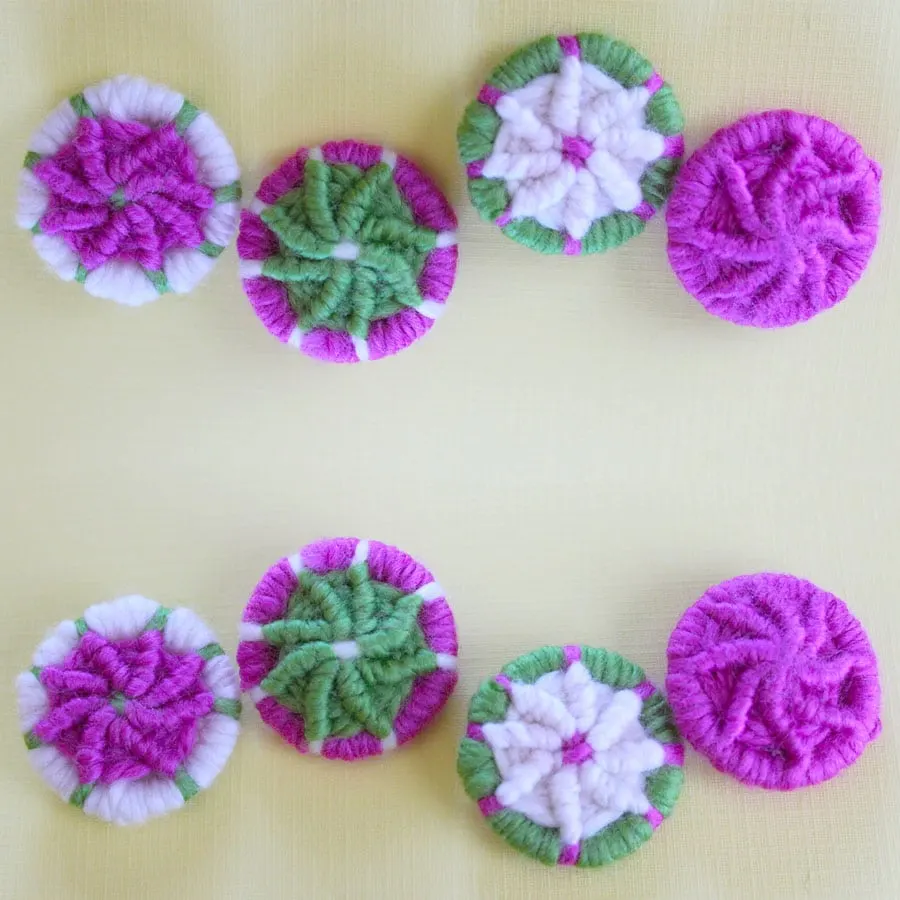 Dorset buttons decorated with yarn.