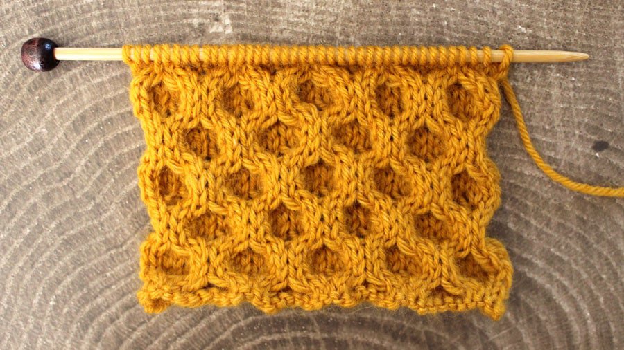 The right side of the Honeycomb knit stitch swatch on needle.