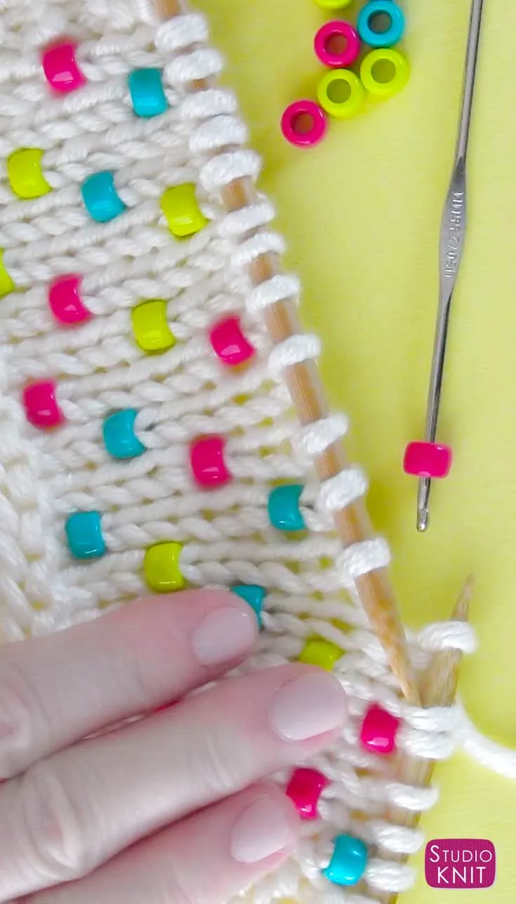 Knitting with colorful beads.