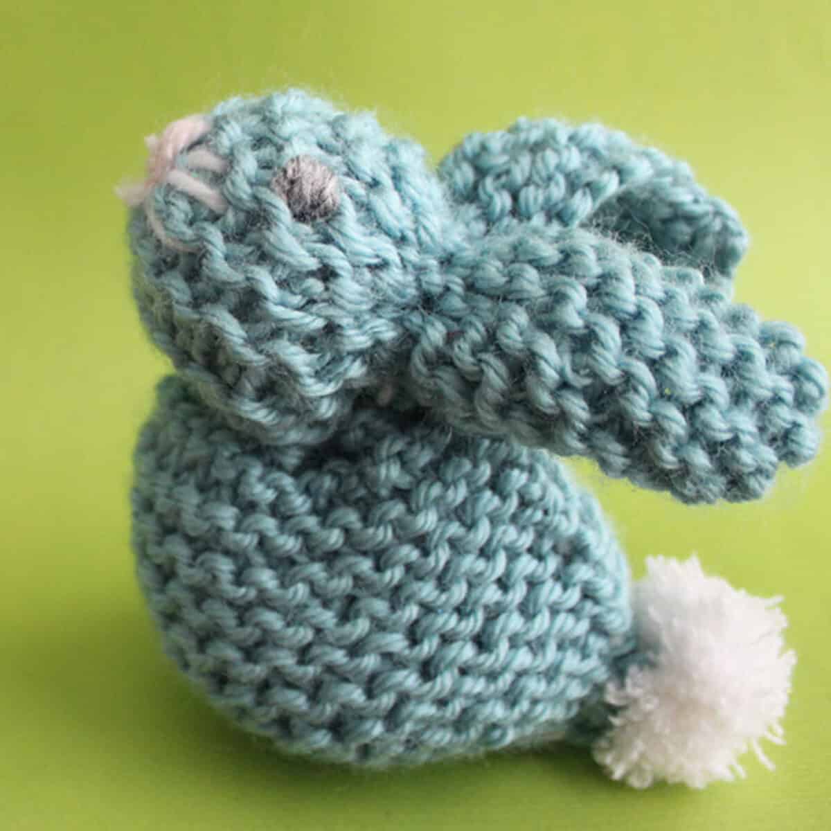 knitted bunny softie in blue yarn