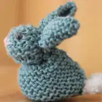 knitted bunny softie in garter stitch with blue yarn