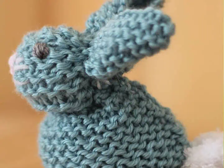 knitted bunny softie in garter stitch with blue yarn