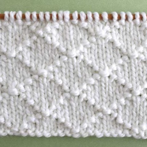 This Diamond Brocade Knit Stitch Pattern is an elegant design created by a simple series of knits and purls.