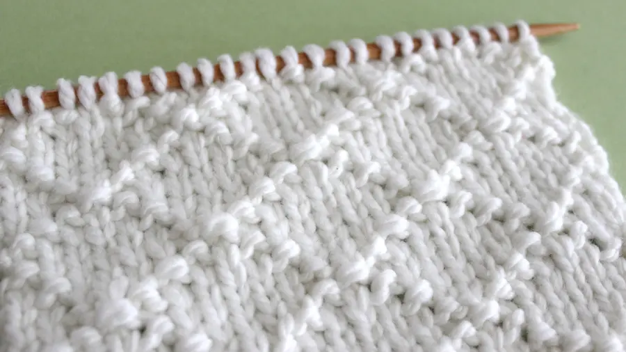 Diamond Brocade Knit Stitch Pattern by Studio Knit with Free Pattern and Video Tutorial