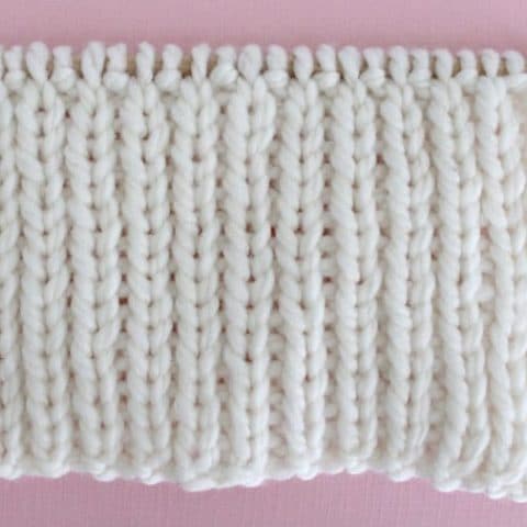 1x1 Rib Knit Stitch Pattern. Get Free Written Patterns, Charts, and Video Tutorials in the Absolute Beginner Knitting Series by Studio Knit.