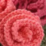 Knitted Rose shapes in peach and pink color yarn.