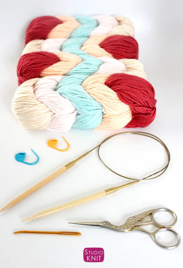 Asymmetrical Shawl was knitted using 4 Caron X Pantone Peach Blush Parfait Braids 