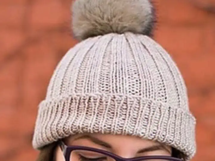 Knitted Ribbed Hat in Grey yarn color with faux fur pom pom