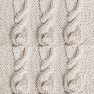 Six Knitted Bunny Cable Patterns in beige color yarn.