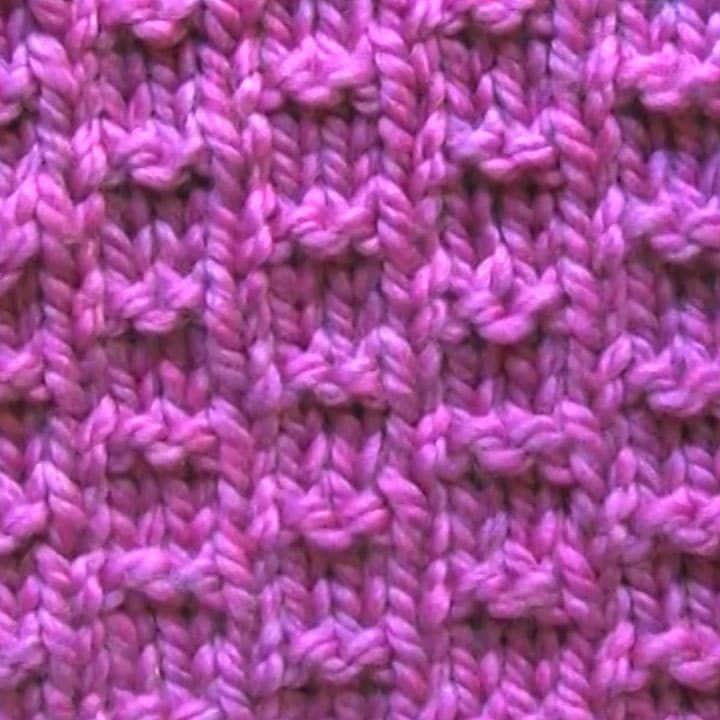 Double Fleck Knitting Pattern in Purple Yarn
