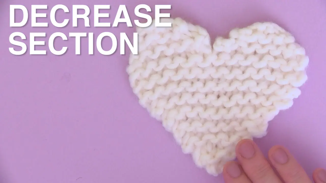 White knitted heart decrease section