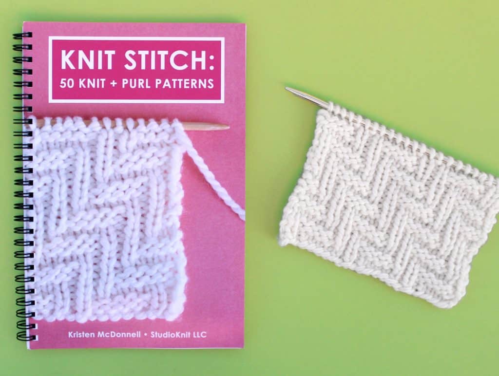 Knit Stitch Pattern Book with Lay Flat Wire-O Binding and Knitted Swatch on Green Background