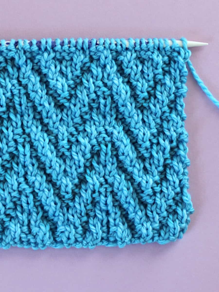 Chevron Zigzag knit stitch pattern in blue color yarn