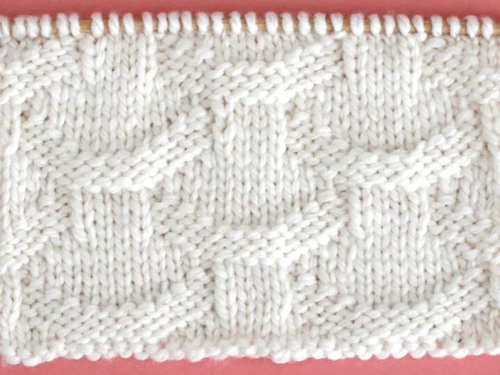 Knit Basket Loop Stitch Pattern with white color yarn on straight knitting needle.