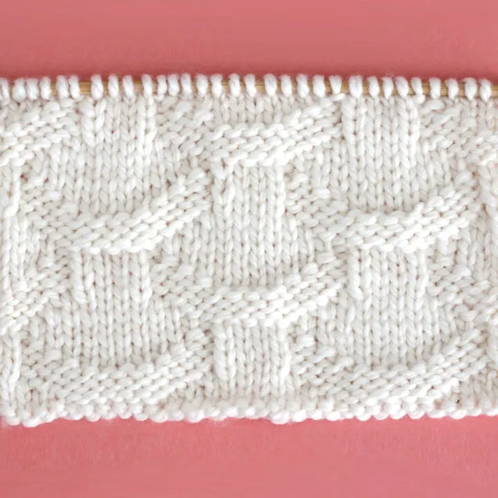 Knit Basket Loop Stitch Pattern with white color yarn on straight knitting needle.