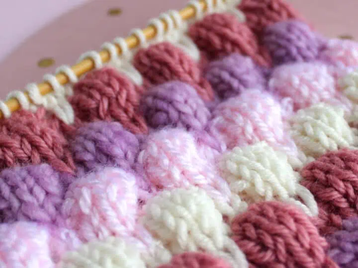 Knitted Bubble Stitch Textures in purple, pink, and white yarn colors.