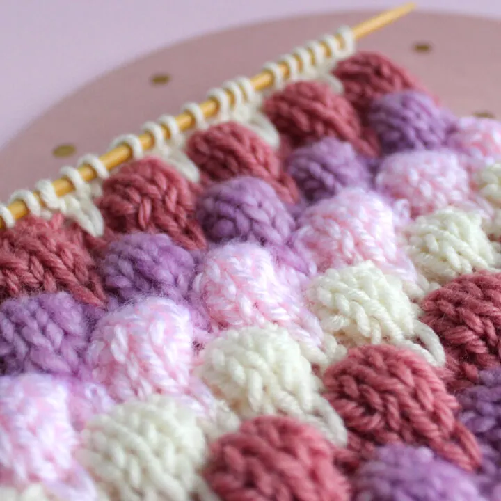 Knitted Bubble Stitch Textures in purple, pink, and white yarn colors.
