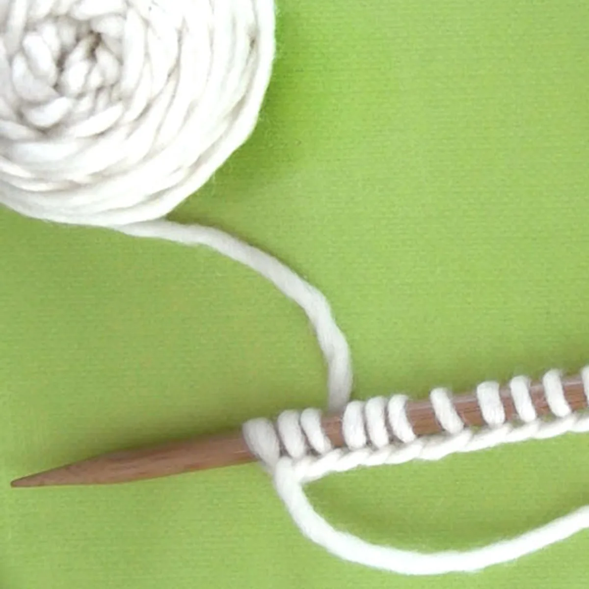 Knitting Stitches Cast On Knitting Needle with white color yarn.