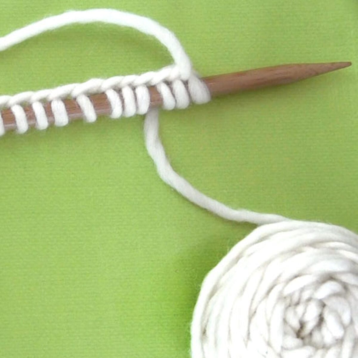 Knitting Stitches Cast On Knitting Needle with white color yarn.