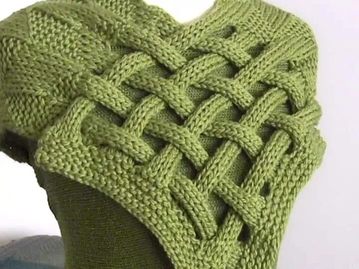 Celtic Saxon Braided Scarf in green yarn on mannequin.