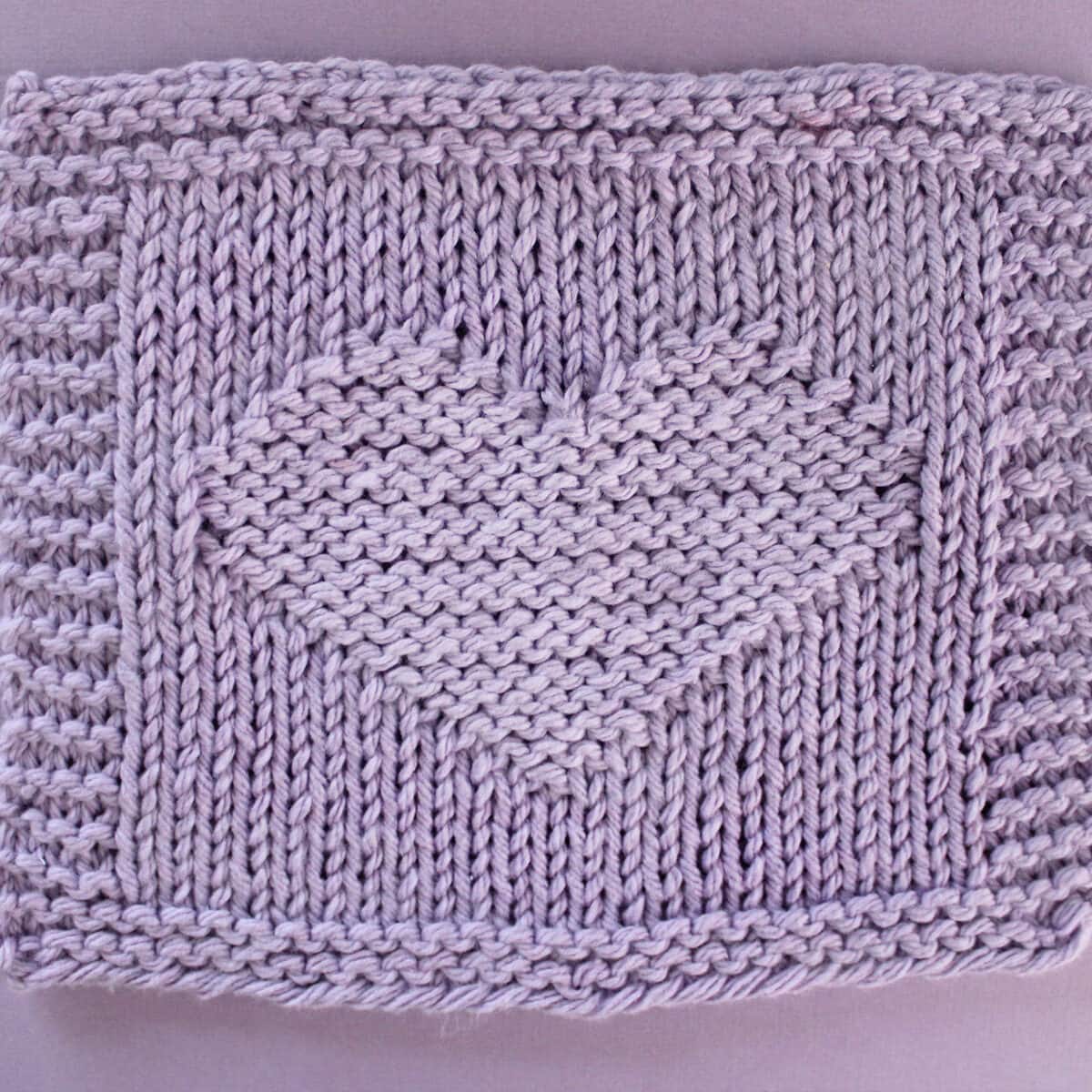 Heart Stitch Knitting Pattern in purple yarn color for dishcloth.