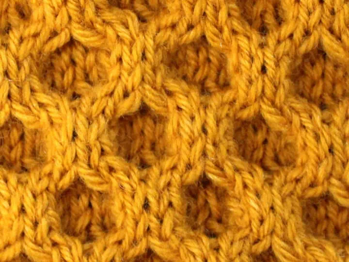 Honeycomb Cable Knit Stitch Pattern in gold yarn color.