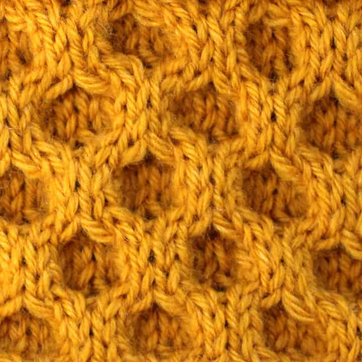 Honeycomb Cable Knit Stitch Pattern in gold yarn color.