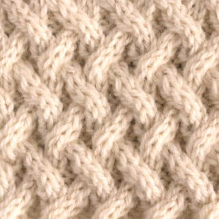 Lattice Cable Knit Stitch Pattern texture in beige color yarn.