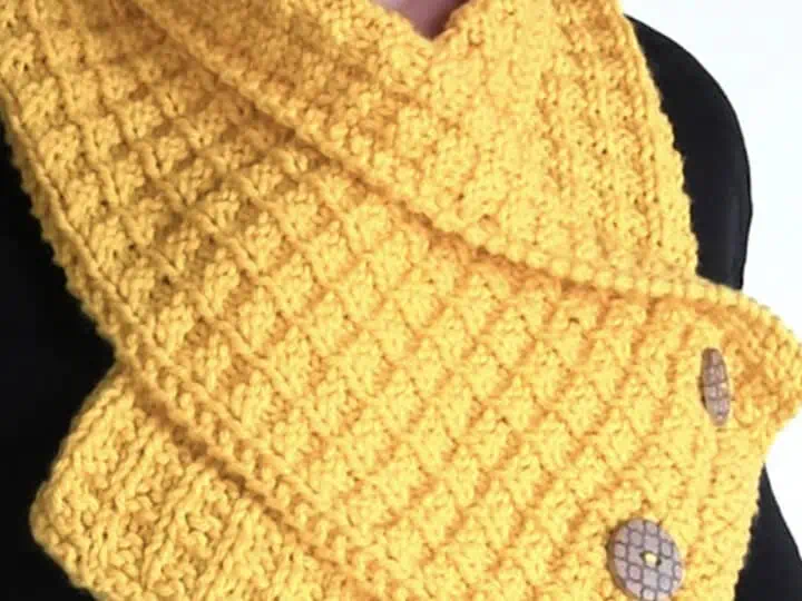 Knitted Waffe Stitch Neck Warmer Scarf in yellow yarn color.