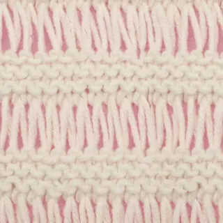Drop Stitch Knitting Pattern texture in white color yarn atop pink background.