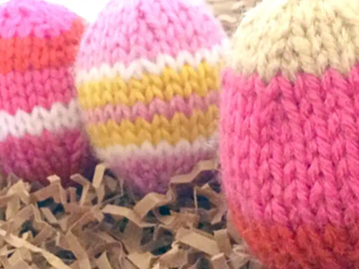 Knitted Easter Egg Softies in yellow and pink yarn colors.