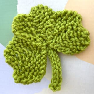 Knitted Shamrock Clover Shape in green color yarn.