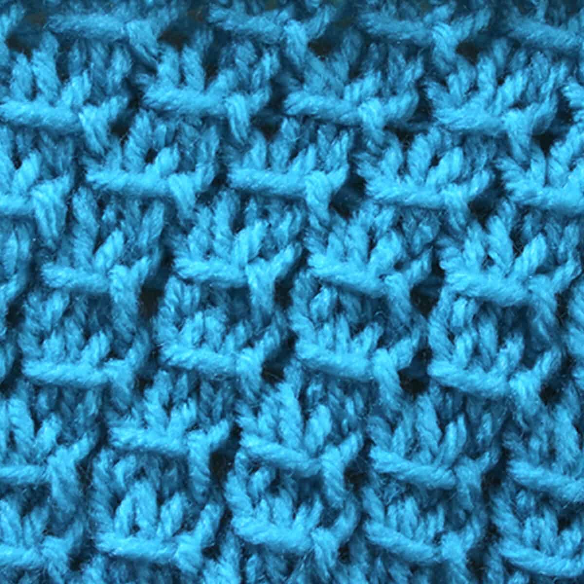 Star Knit Stitch Pattern brioche texture in blue color yarn.