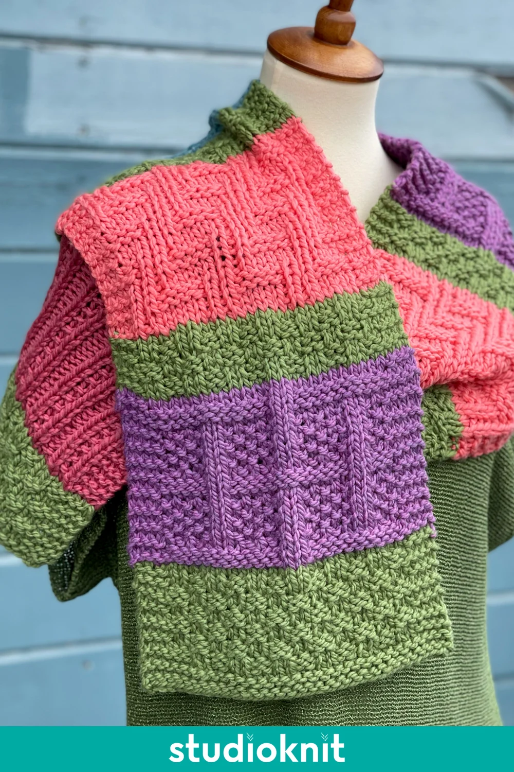Color Block Knitted Scarf with Lattice Seed Stitch on manequin.