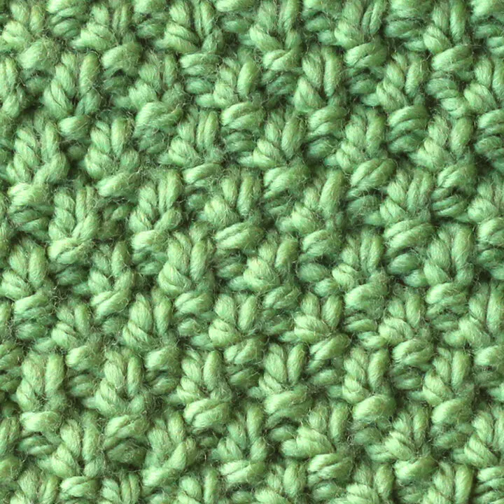 Irish Moss Knit Stitch pattern in green color yarn.