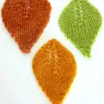 Three knitted leaf shapes.