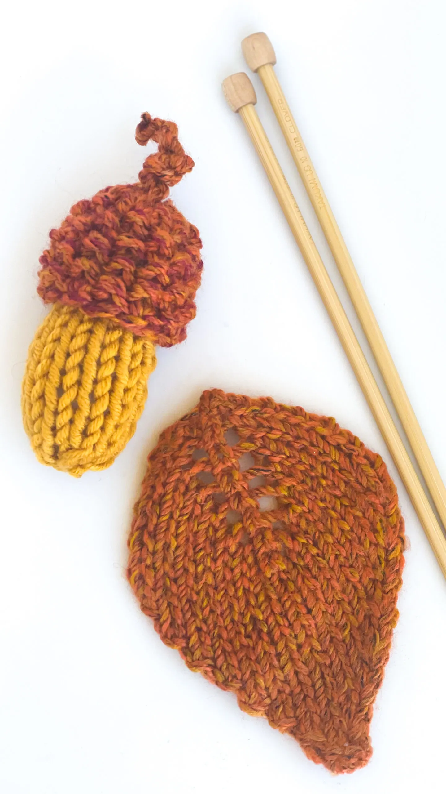 Knitted Acorn and Leaf with needles.