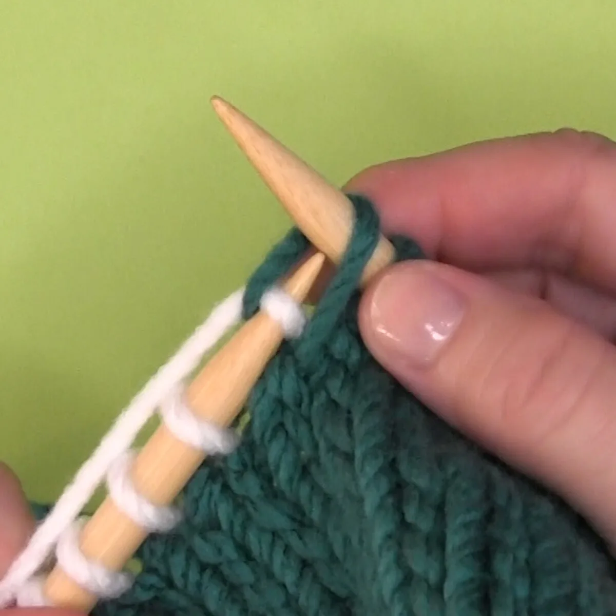 Left-handed demonstration of knitting through the back loop.
