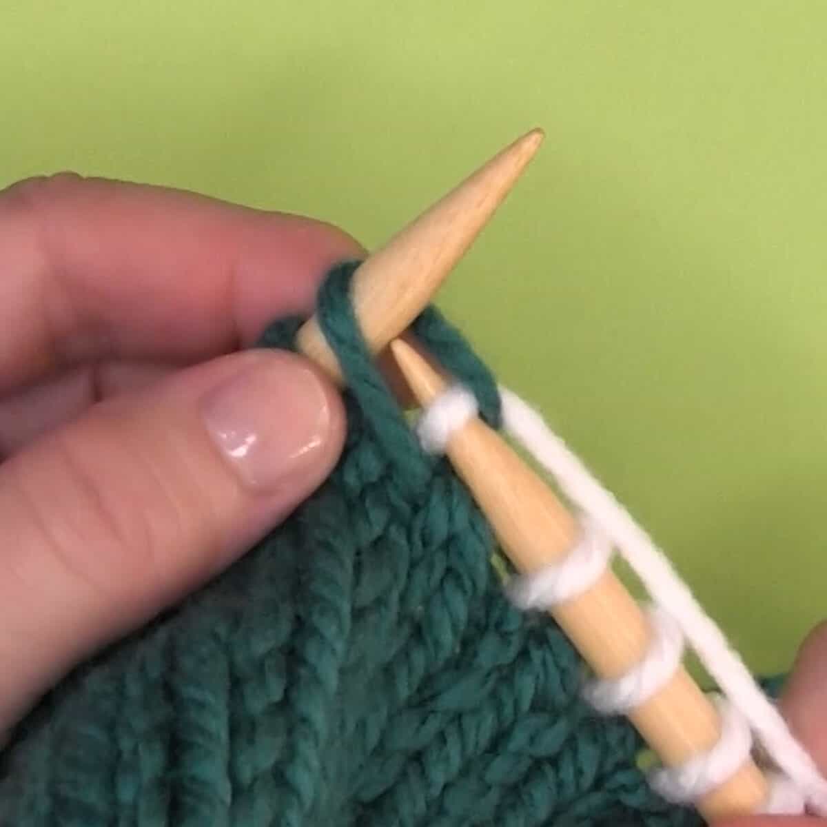 Right-handed demonstration of knitting through the back loop.