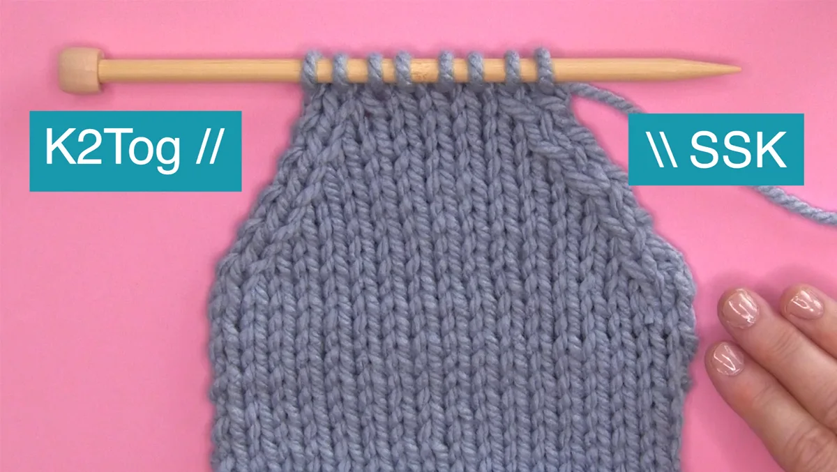K2Tog and SSK Knitting decrease sample swatch on knitting needle.