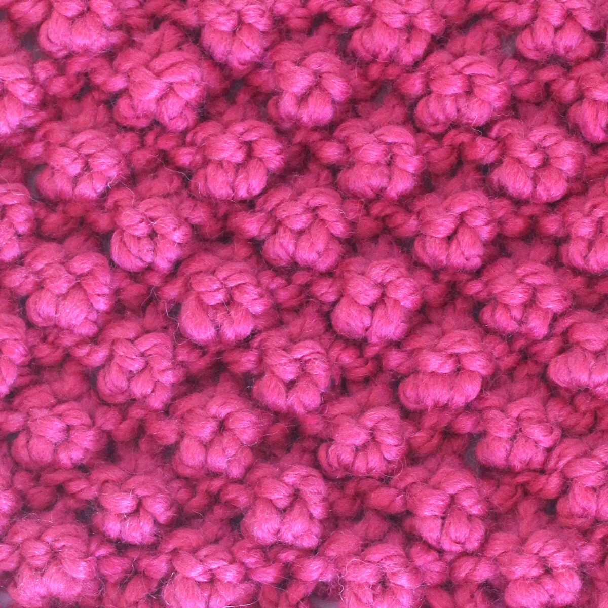 Raspberry Stitch knitted with pink color yarn.