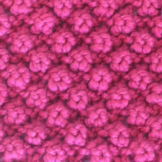Raspberry Stitch knitted with pink color yarn.